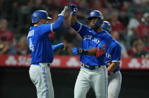 Aug 11, 2021; Anaheim, California, USA; Toronto Blue Jays right fielder Teoscar Hernandez (37) celebrates with center fielder George Springer (4) after hitting a three-run home run in the fifth inning against the Los Angeles Angels at Angel Stadium. Mandatory Credit: Kirby Lee-USA TODAY Sports