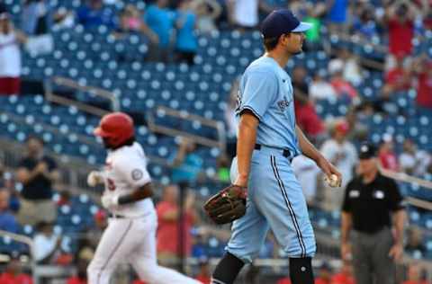 Aug 18, 2021; Washington, District of Columbia, USA; Toronto Blue Jays relief pitcher Brad Hand (52) reacts after giving up a three run home run to Washington Nationals first baseman Josh Bell (19) during the seventh inning at Nationals Park. Mandatory Credit: Brad Mills-USA TODAY Sports