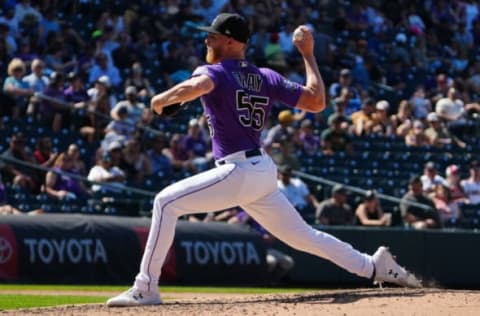 Aug 22, 2021; Denver, Colorado, USA; Colorado Rockies starting pitcher Jon Gray (55) delivers a pitch in the sixth inning against the Arizona Diamondbacks at Coors Field. Mandatory Credit: Ron Chenoy-USA TODAY Sports