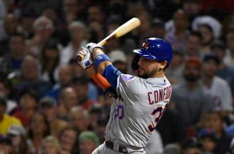 Sep 21, 2021; Boston, Massachusetts, USA; New York Mets right fielder Michael Conforto (30) hits an RBI single against the Boston Red Sox during the fourth inning at Fenway Park. Mandatory Credit: Bob DeChiara-USA TODAY Sport.