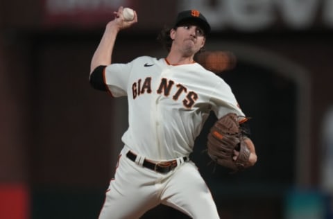 Oct 14, 2021; San Francisco, California, USA; San Francisco Giants starting pitcher Kevin Gausman (34) throws against the Los Angeles Dodgers during the ninth inning in game five of the 2021 NLDS at Oracle Park. Mandatory Credit: Neville E. Guard-USA TODAY Sports