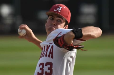 Alabama pitcher Luke Holman (33) pitches in relief against Binghamton Friday, March 11, 2022, in Sewell-Thomas Stadium.Alabama Vs Binghamton Baseball