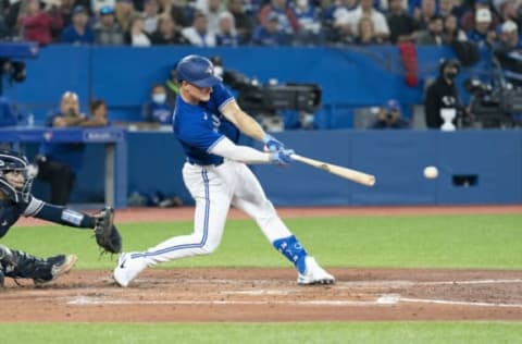 May 2, 2022; Toronto, Ontario, CAN; Toronto Blue Jays third baseman Matt Chapman (26) hits an RBI single during the fourth inning against the New York Yankees at Rogers Centre. Mandatory Credit: Nick Turchiaro-USA TODAY Sports