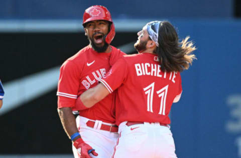 Jul 16, 2022; Toronto, Ontario, CAN; Toronto Blue Jays right fielder Teoscar Hernandez (37) celebrates with shortstop Bo Bichette (11) after hitting a walkoff RBI single against the Kansas City Royals in the 10th inning at Rogers Centre. Mandatory Credit: Dan Hamilton-USA TODAY Sports