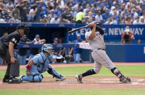 Aug 14, 2022; Toronto, Ontario, CAN; Cleveland Guardians first baseman Josh Naylor (22) hits an RBI single against the Toronto Blue Jays during the fifth inning at Rogers Centre. Mandatory Credit: Nick Turchiaro-USA TODAY Sports