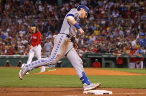 Aug 25, 2022; Boston, Massachusetts, USA; Toronto Blue Jays catcher Danny Jansen (9) rounds third base after hitting a home run during the sixth inning against the Boston Red Sox at Fenway Park. Mandatory Credit: Paul Rutherford-USA TODAY Sports