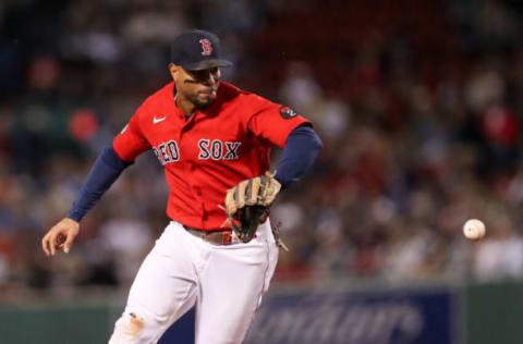 Sep 16, 2022; Boston, Massachusetts, USA; Boston Red Sox shortstop Xander Bogaerts (2) fields a ground ball during the fifth inning against the Kansas City Royals at Fenway Park. Mandatory Credit: Paul Rutherford-USA TODAY Sports