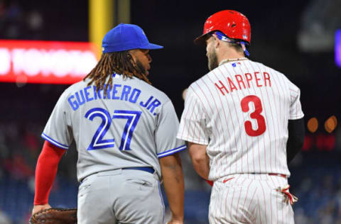 Sep 20, 2022; Philadelphia, Pennsylvania, USA; Toronto Blue Jays first baseman Vladimir Guerrero Jr. (27) and Philadelphia Phillies designated hitter Bryce Harper (3) at first base at Citizens Bank Park. Mandatory Credit: Eric Hartline-USA TODAY Sports