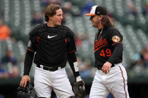 Oct 5, 2022; Baltimore, MD, USA; Baltimore Orioles catcher Adley Rutschman (35) greets pitcher D.L. Hall (49) after he pitched the eighth inning against the Toronto Blue Jays at Oriole Park at Camden Yards. Mandatory Credit: Mitch Stringer-USA TODAY Sports