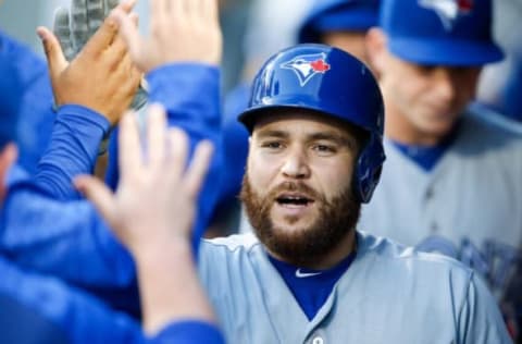 Aug 3, 2018; Seattle, WA, USA; Toronto Blue Jays catcher Russell Martin (55) is greeted in the dugout after hitting a solo-home run against the Seattle Mariners during the fourth inning at Safeco Field. Mandatory Credit: Joe Nicholson-USA TODAY Sports