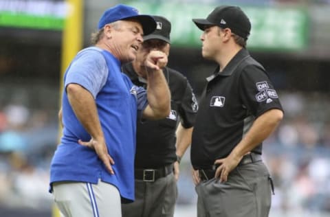 Aug 19, 2018; Bronx, NY, USA; Toronto Blue Jays manager John Gibbons (5) argues with first base umpire Jansen Visconti (52) in the sixth inning agains the New York Yankees at Yankee Stadium. Mandatory Credit: Wendell Cruz-USA TODAY Sports