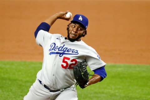 Oct 8, 2020; Arlington, Texas, USA; Los Angeles Dodgers relief pitcher Pedro Baez (52) pitches against the San Diego Padres during the eighth inning during game three of the 2020 NLDS at Globe Life Field. Mandatory Credit: Kevin Jairaj-USA TODAY Sports