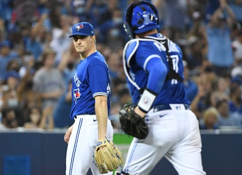 Aug 5, 2021; Toronto, Ontario, CAN; Toronto Blue Jays pitcher Ross Stripling (48) speaks with catcher Reese McGuire (7) as they leave the field at the end of the sixth inning against the Cleveland Indians at Rogers Centre. Mandatory Credit: Dan Hamilton-USA TODAY Sports