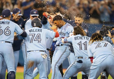 Sep 3, 2021; Toronto, Ontario, CAN; Toronto Blue Jays shortstop Marcus Semien (10) celebrates with the team after hitting a walkoff home run during the ninth inning against the Oakland Athletics at Rogers Centre. Mandatory Credit: Nick Turchiaro-USA TODAY Sports