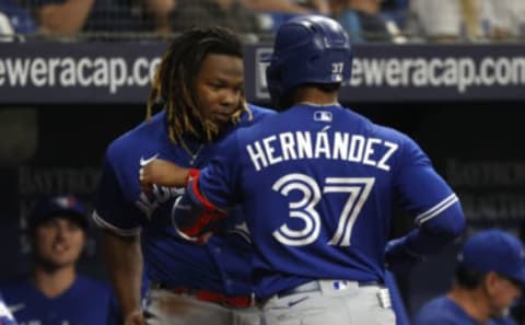 Sep 20, 2021; St. Petersburg, Florida, USA; Toronto Blue Jays right fielder Teoscar Hernandez (37) celebrates with designated hitter Vladimir Guerrero Jr. (27) his solo home run hit against the Tampa Bay Rays during the second inning at Tropicana Field. Mandatory Credit: Kim Klement-USA TODAY Sports