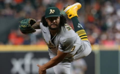 Oct 1, 2021; Houston, Texas, USA; Oakland Athletics starting pitcher Sean Manaea (55) pitches against the Houston Astros in the third inning at Minute Maid Park. Mandatory Credit: Thomas Shea-USA TODAY Sports