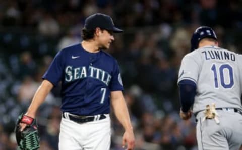 May 7, 2022; Seattle, Washington, USA; Seattle Mariners starting pitcher Marco Gonzales (7) looks back to talk to former teammate and current Tampa Bay Rays catcher Mike Zunino (10) after the second inning at T-Mobile Park. Mandatory Credit: Lindsey Wasson-USA TODAY Sports