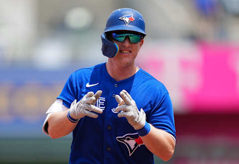 Jun 8, 2022; Kansas City, Missouri, USA; Toronto Blue Jays catcher Zack Collins (21) gestures to the dugout after hitting a home run against the Kansas City Royals during the third inning at Kauffman Stadium. Mandatory Credit: Jay Biggerstaff-USA TODAY Sports