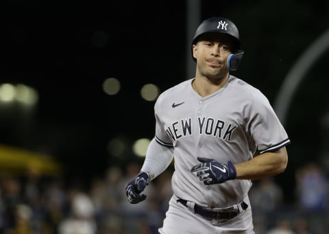 Jul 6, 2022; Pittsburgh, Pennsylvania, USA; New York Yankees designated hitter Giancarlo Stanton (27) circles the bases on a solo home run against the Pittsburgh Pirates during the ninth inning at PNC Park. The Yankees shutout the Pirates 16-0. Mandatory Credit: Charles LeClaire-USA TODAY Sports