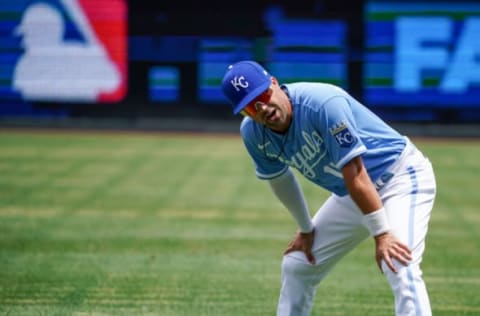 Jul 24, 2022; Kansas City, Missouri, USA; Kansas City Royals second baseman Whit Merrifield (15) stretches prior to the game against the Tampa Bay Rays at Kauffman Stadium. Mandatory Credit: Denny Medley-USA TODAY Sports