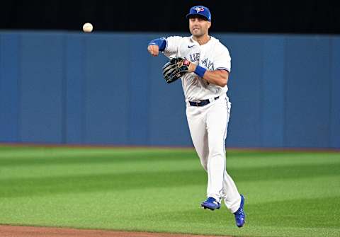 Aug 12, 2022; Toronto, Ontario, CAN; Toronto Blue Jays second baseman Whit Merrifield (1) throws to first base but not in time to force out Cleveland Guardians third baseman Jose Ramirez (not pictured) in the eighth inning at Rogers Centre. Mandatory Credit: Dan Hamilton-USA TODAY Sports