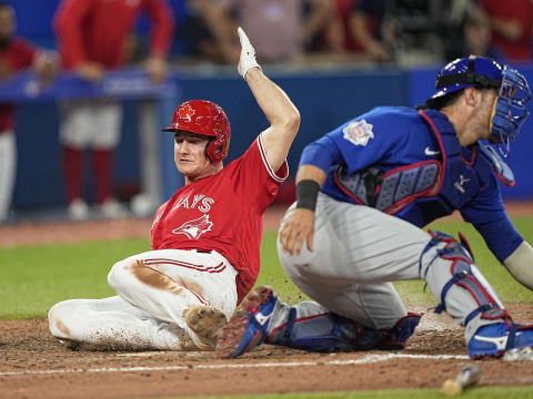 Aug 29, 2022; Toronto, Ontario, CAN; Toronto Blue Jays third baseman Matt Chapman (26) scores the game winning run against the Chicago Cubs on a single by Toronto Blue Jays catcher Danny Jansen (not pictured)during the eleventh inning at Rogers Centre. Mandatory Credit: John E. Sokolowski-USA TODAY Sports