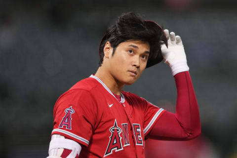 Oct 3, 2022; Oakland, California, USA; Los Angeles Angels designated hitter Shohei Ohtani (17) removes his helmet during an at bat against the Oakland Athletics in the first inning at RingCentral Coliseum. Mandatory Credit: Darren Yamashita-USA TODAY Sports