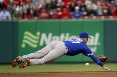 Apr 27, 2017; St. Louis , MO, USA; Toronto Blue Jays shortstop Ryan Goins (17) dives but is unable to field a ground ball hit by St. Louis Cardinals second baseman Kolten Wong (16) during the third inning at Busch Stadium. Mandatory Credit: Jeff Curry-USA TODAY Sports