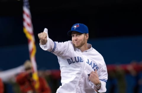 Apr 4, 2014; Toronto, Ontario, CAN; Former Toronto Blue Jays pitcher Roy Halladay throws out the first pitch in a game against the New York Yankees at Rogers Centre. Mandatory Credit: Nick Turchiaro-USA TODAY Sports