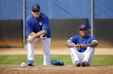 Feb 15, 2017; Dunedin, FL, USA; Toronto Blue Jays manager John Gibbons (5) and starting pitcher Marcus Stroman (6) talk at Cecil P. Englebert Recreation Complex. Mandatory Credit: Kim Klement-USA TODAY Sports