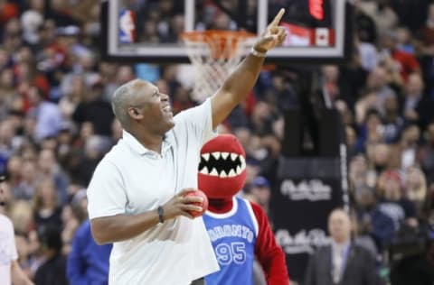 Apr 7, 2017; Toronto, Ontario, CAN; Former Toronto Blue Jay Joe Carter prepares to throw a mini ball to a fan during the first half of a game between the Miami Heat and Toronto Raptors at the Air Canada Centre. Mandatory Credit: John E. Sokolowski-USA TODAY Sports