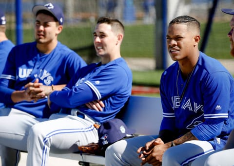 Feb 16, 2017; Dunedin, FL, USA; Toronto Blue Jays starting pitcher Marcus Stroman (6), starting pitcher Aaron Sanchez (41) and pitcher Conner Greene (22) sit on the bench at Cecil P. Englebert Recreation Complex. Mandatory Credit: Kim Klement-USA TODAY Sports