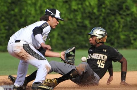 Aug 15, 2015; Chicago, IL, USA; American team Jordon Adell (45) steals second base as National second baseman Bo Bichette (left) applies a tag during the sixth inning in the Under Armour All America Baseball game at Wrigley field. Mandatory Credit: David Banks-USA TODAY Sports