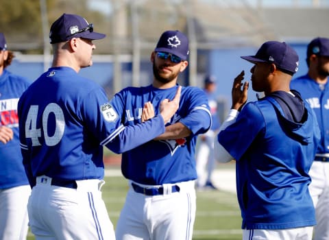 Feb 17, 2017; Dunedin, FL, USA; Toronto Blue Jays pitching coach Pete Walker (40), starting pitcher Marco Estrada (25) and starting pitcher Marcus Stroman (6) talk during spring training at Cecil P. Englebert Recreation Complex. Mandatory Credit: Kim Klement-USA TODAY Sports