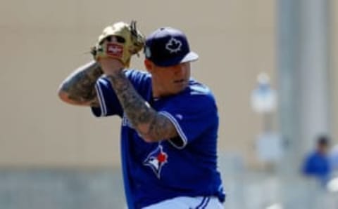 Mar 3, 2017; Dunedin, FL, USA; Toronto Blue Jays pitcher Mat Latos (57) throws a pitch during the third inning against the New York Yankees at Florida Auto Exchange Stadium. Mandatory Credit: Kim Klement-USA TODAY Sports