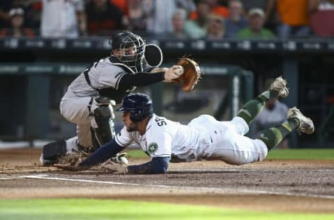 May 27, 2017; Houston, TX, USA; Houston Astros right fielder George Springer (4) slides safely under the tag of Baltimore Orioles catcher Caleb Joseph (36) to score a run during the first inning at Minute Maid Park. Mandatory Credit: Troy Taormina-USA TODAY Sports