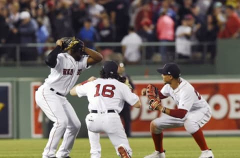 Jun 9, 2017; Boston, MA, USA; Boston Red Sox left fielder Andrew Benintendi (16) center fielder Jackie Bradley Jr. (19) and right fielder Mookie Betts (50) reacts after defeating the Detroit Tigers at Fenway Park. Mandatory Credit: Bob DeChiara-USA TODAY Sports