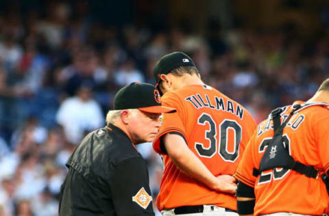 Jun 10, 2017; Bronx, NY, USA; Baltimore Orioles starting pitcher Chris Tillman (30) leaves the mound after being taken out of the game in the second inning after giving up nine runs against the New York Yankees at Yankee Stadium. Mandatory Credit: Andy Marlin-USA TODAY Sports