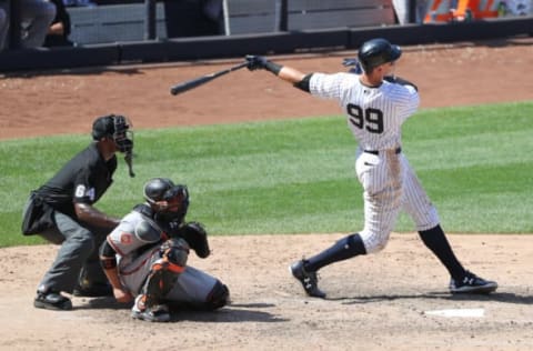 Jun 11, 2017; Bronx, NY, USA; New York Yankees right fielder Aaron Judge (99) hits a home run to left center field during the sixth inning against the Baltimore Orioles at Yankee Stadium. Mandatory Credit: Anthony Gruppuso-USA TODAY Sports