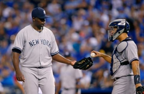 May 17, 2017; Kansas City, MO, USA; New York Yankees catcher Gary Sanchez (24) hands the ball back to starting pitcher Michael Pineda (35) in the sixth inning of the game agains the Kansas City Royals at Kauffman Stadium. The Yankees won 11-7. Mandatory Credit: Jay Biggerstaff-USA TODAY Sports