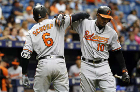 Jun 25, 2017; St. Petersburg, FL, USA; Baltimore Orioles second baseman Jonathan Schoop (6) is congratulated by center fielder Adam Jones (10) as he hits a home run during the eighth inning against the Tampa Bay Rays at Tropicana Field. Mandatory Credit: Kim Klement-USA TODAY Sports