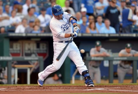 Aug 13, 2014; Kansas City, MO, USA; Kansas City Royals designated hitter Billy Butler (16) connects for a single in the first inning against the Oakland Athletics at Kauffman Stadium. Mandatory Credit: Denny Medley-USA TODAY Sports