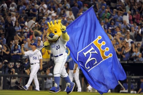 Aug 11, 2014; Kansas City, MO, USA; Kansas City Royals mascot Sluggerrr waves a flag after the game against the Oakland Athletics at Kauffman Stadium. Kansas City won the game 3-2. Mandatory Credit: John Rieger-USA TODAY Sports