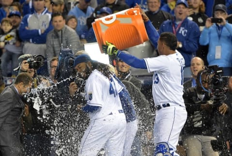 Oct 28, 2015; Kansas City, MO, USA; Kansas City Royals starting pitcher Johnny Cueto (47) is dunked with a cooler of water by catcher Salvador Perez (13) after throwing a complete game to defeat the New York Mets in game two of the 2015 World Series at Kauffman Stadium. Mandatory Credit: Denny Medley-USA TODAY Sports