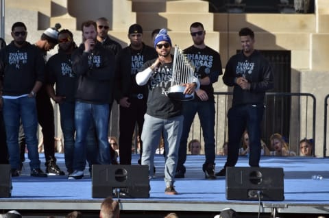 Nov 3, 2015; Kansas City, MO, USA; Kansas City Royals designated hitter Christian Colon speaks to fans while holding the Commissioners Trophy during the World Series victory celebration on stage at Union Station. Mandatory Credit: Denny Medley-USA TODAY Sports