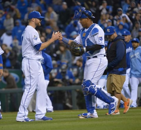 Apr 8, 2016; Kansas City, MO, USA; Kansas City Royals relief pitcher Wade Davis (17) is congratulated by catcher Salvador Perez (13) after the 4-3 win over the Minnesota Twins at Kauffman Stadium. Mandatory Credit: Denny Medley-USA TODAY Sports