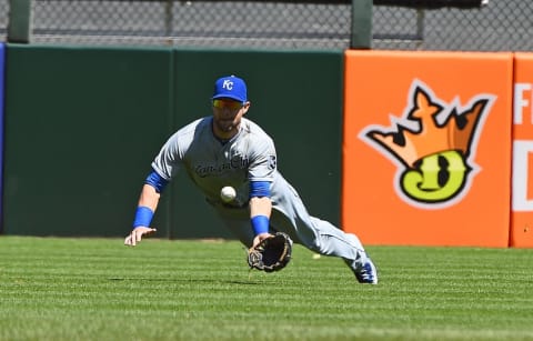 Apr 26, 2015; Chicago, IL, USA; Kansas City Royals left fielder Alex Gordon (4) makes a diving catch against the Chicago White Sox during the ninth inning at U.S Cellular Field. The White Sox and Royals complete their suspended game from Friday, April 24th, in the ninth inning due to weather, Chicago White Sox defeat the Kansas City Royals 3-2. Mandatory Credit: Mike DiNovo-USA TODAY Sports