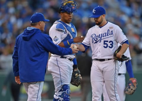 May 14, 2016; Kansas City, MO, USA; Kansas City Royals pitcher Dillon Gee (53) is taken out of the game against the Atlanta Braves by manager Ned Yost (left) during the sixth inning at Kauffman Stadium. Mandatory Credit: Peter G. Aiken-USA TODAY Sports