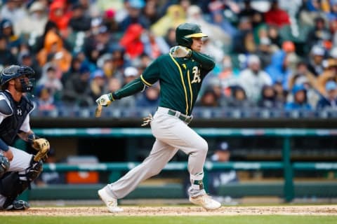 Apr 28, 2016; Detroit, MI, USA; Oakland Athletics right fielder Josh Reddick (22) hits an RBI single in the third inning against the Detroit Tigers at Comerica Park. Mandatory Credit: Rick Osentoski-USA TODAY Sports