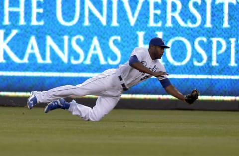 May 19, 2015; Kansas City, MO, USA; Kansas City Royals center fielder Lorenzo Cain (6) makes a low running catch in the third inning against the Cincinnati Reds at Kauffman Stadium. Mandatory Credit: Denny Medley-USA TODAY Sports